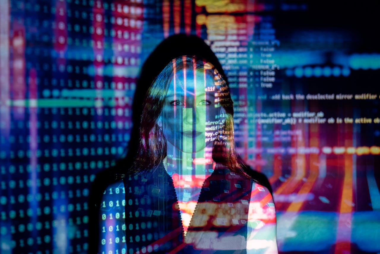 home-img A woman with digital code projections on her face, representing technology and future concepts.